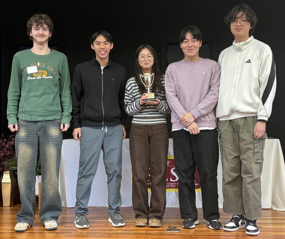 2026 McIntosh Math Team holding their first place award at the Jan. 28 regional competition. 