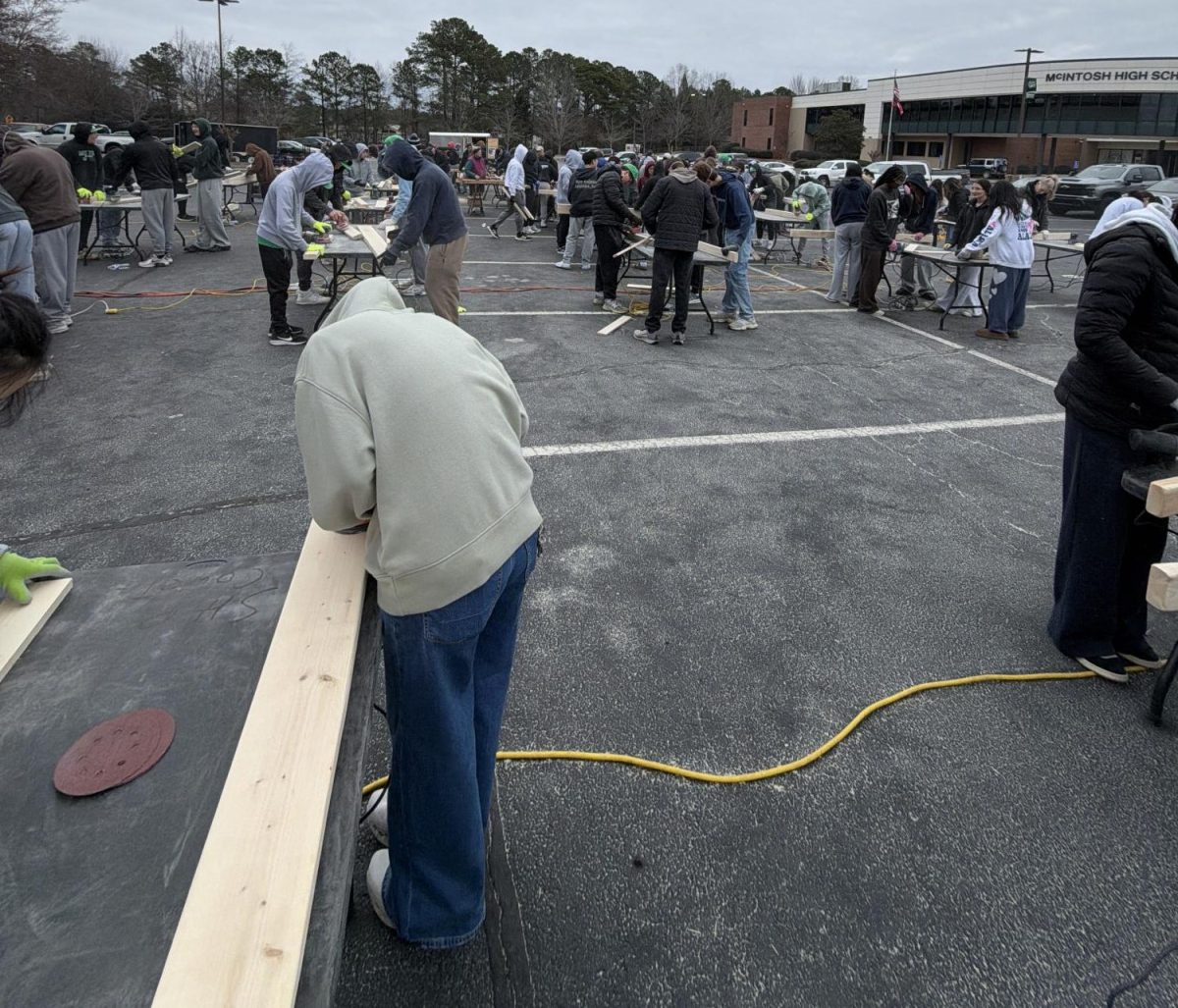 More than 100 students volunteered to build beds. Students from McIntosh and J.C. Booth Middle School signed up to help.