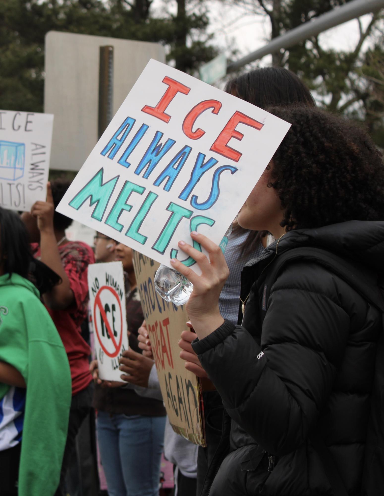 Protestor outside of Walgreens on the corner of Hwy. 54 and Peachtree Parkway during the Jan. 30 walkout. Photo by Jazlenne Martinez-Morales