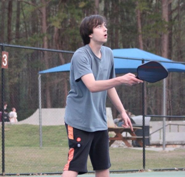Sophomore Brody Moseley waits for the perfect time to return a volley.