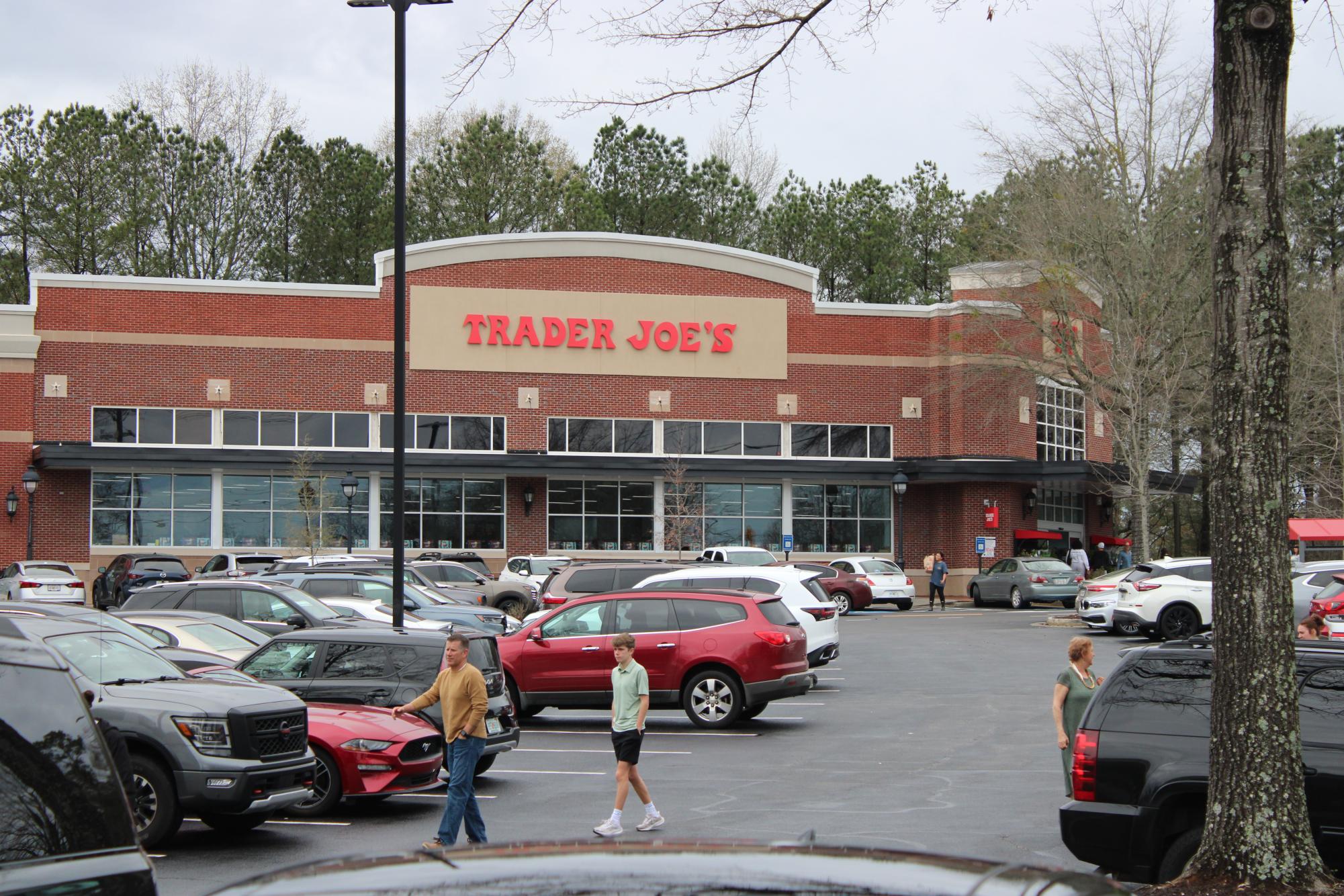 Avenue shoppers walking through the local Trader Joe's parking lot.