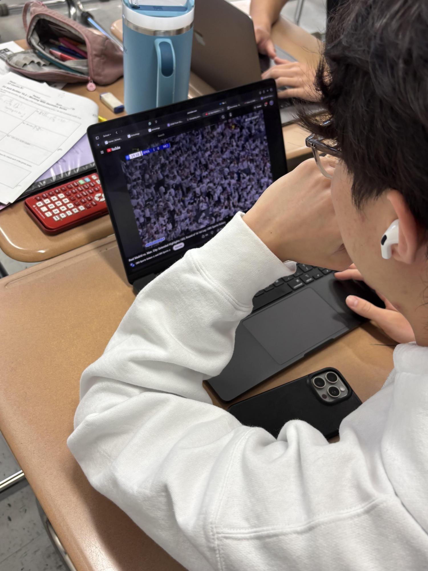 Picture of student using his computer to watch youtube during study hall.