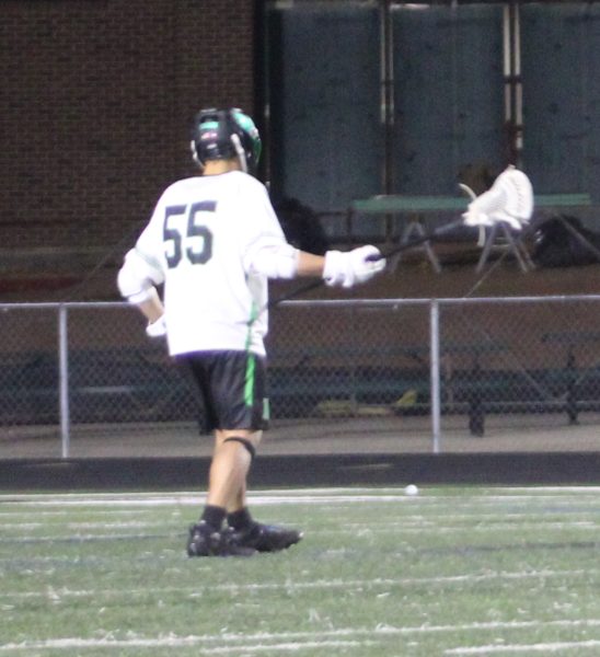 Close defense player Soren Tharp playing in a lacrosse game.